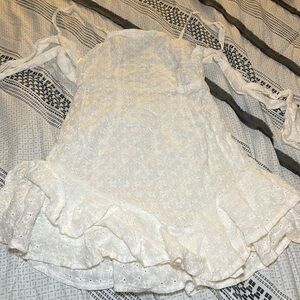 I’m selling a ladies mini dress from SHEIN tie around neck n back